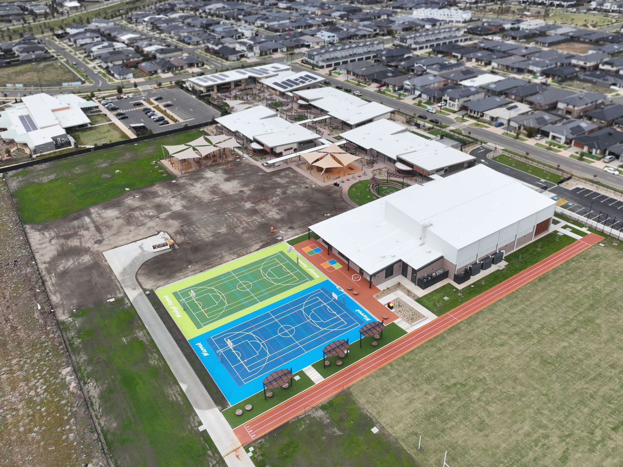 Aerial view of Australian school with sports facilities.